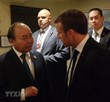 Thủ tướng Nguyễn Xuân Phúc gặp Tổng thống Pháp Emmanuel Macron. (Ảnh: TTXVN)