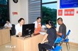 Tổ hỗ trợ, hướng dẫn kê khai giải quyết thủ tục hành chính được thành lập ở phường Yên Bái, tỉnh Lào Cai nhằm giúp người dân hạn chế đi lại nhiều lần. (Ảnh: TTXVN)